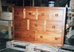 A versatile piece of oak furniture for any dining room, living room and more, offering custom storage and display too