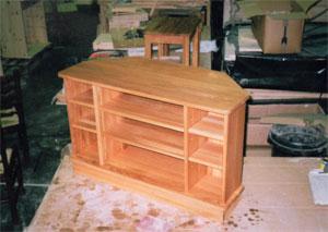 Corner entertainment units in pine or oak, with a variety of combinations of cupboards, drawers and shelves to tidy everything away.